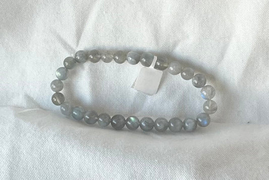 A bracelet of small gray semi-irridescent beads