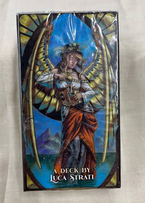 Steampunk Art Nouveau tarot deck back - game box featuring a fantasy character with mechanical wings, labeled 'A Deck by Luca Strati'.