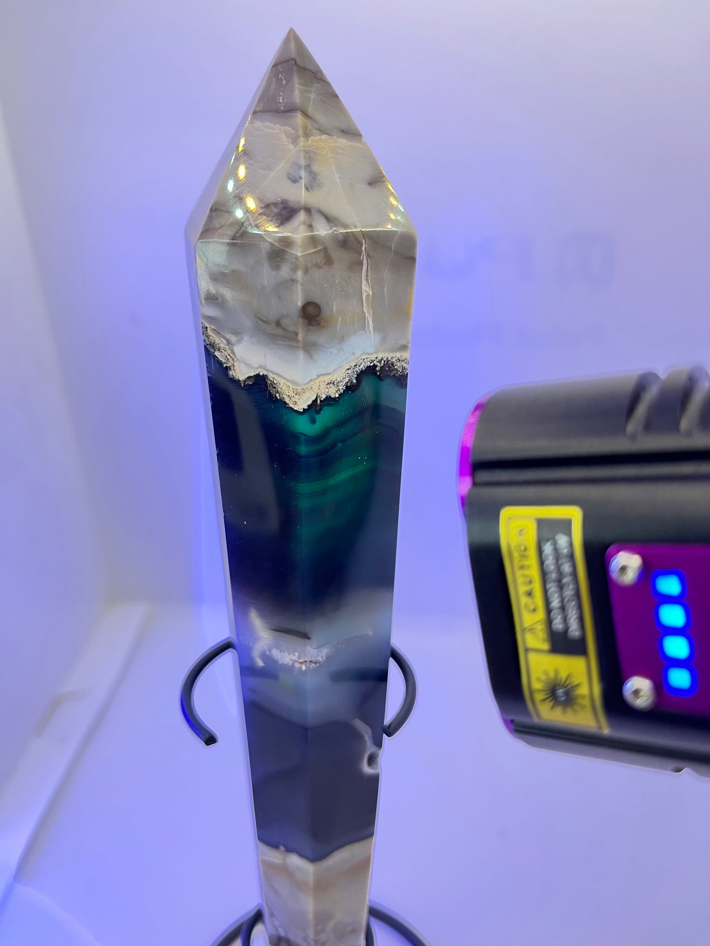 Crystal with a colorful interior under a UV light source