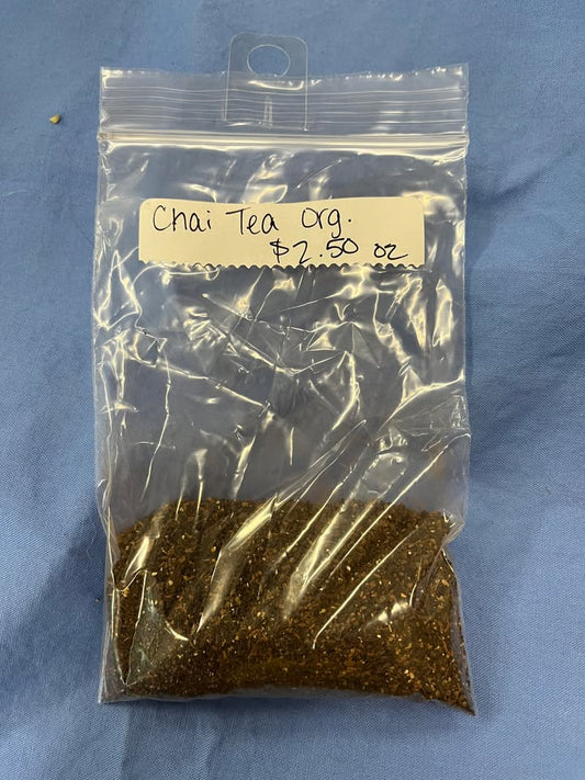 Brown tea blend is finely ground in a clear pastic bag.  Label says "Chai Tea Organic, $2.50 per oz"
