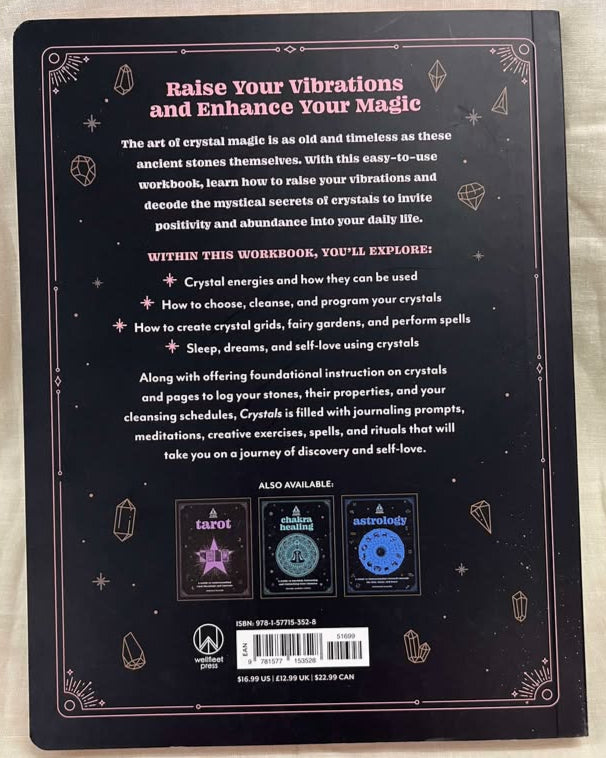 Back cover of a book with crystal magic-themed text and graphics on a beige fabric background