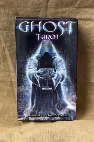 Ghost Tarot card deck front shows a spirit clothed in a robe, faceless, offering a goblet.  