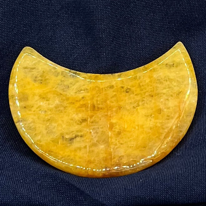 Yellow crystal moon on a navy blue background.