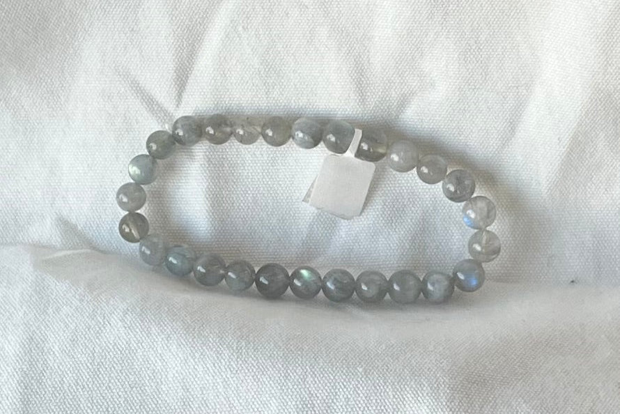 A bracelet of small gray semi-irridescent beads