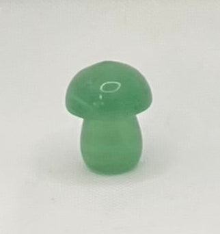 A green semi-transparent  crystal mushroom on a white background