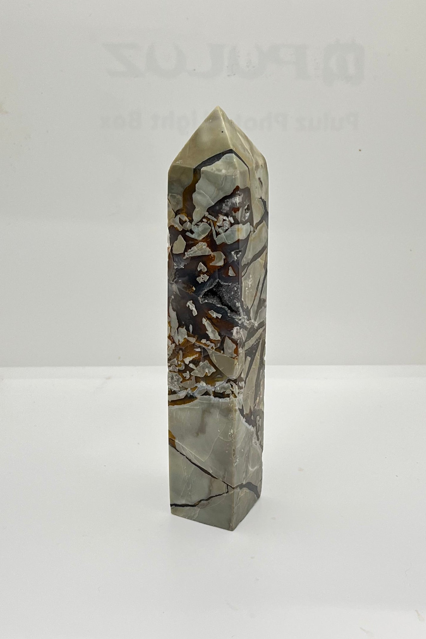 Marbled crystal tower on a white background