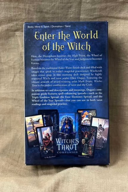 Blue tarot card box with 'Enter the World of the Witch' text on a beige fabric background